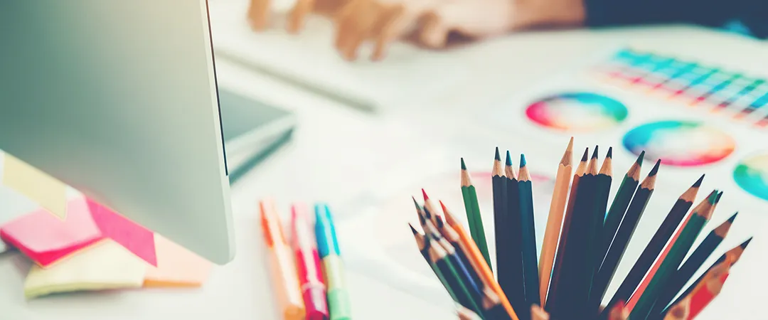 Creative team reviewing visual communication concepts in a Brussels design studio